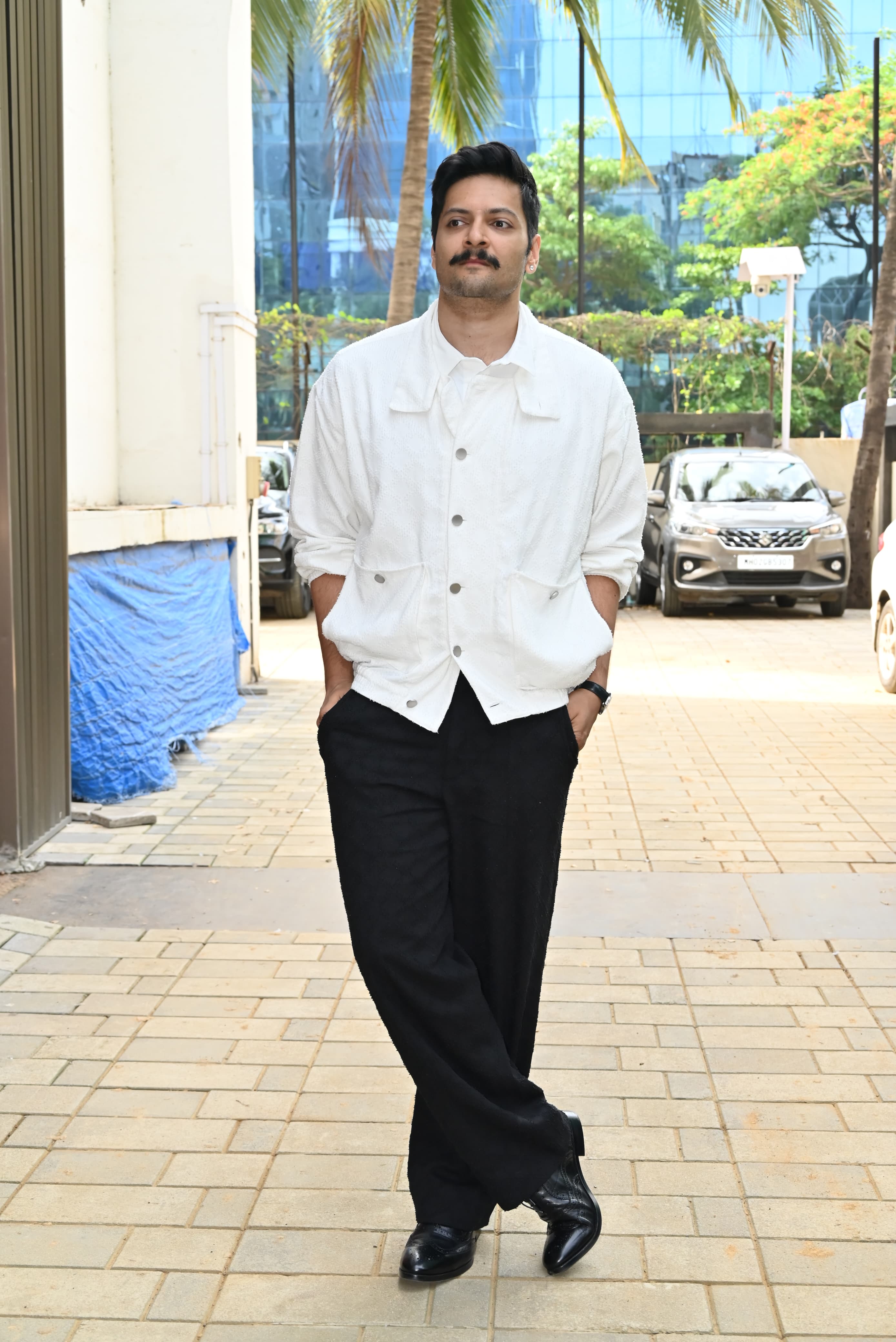 <p>Ali Fazal looked uber cool as always in a white shirt with black pants and black shoes. His moustache complemented the look.</p>